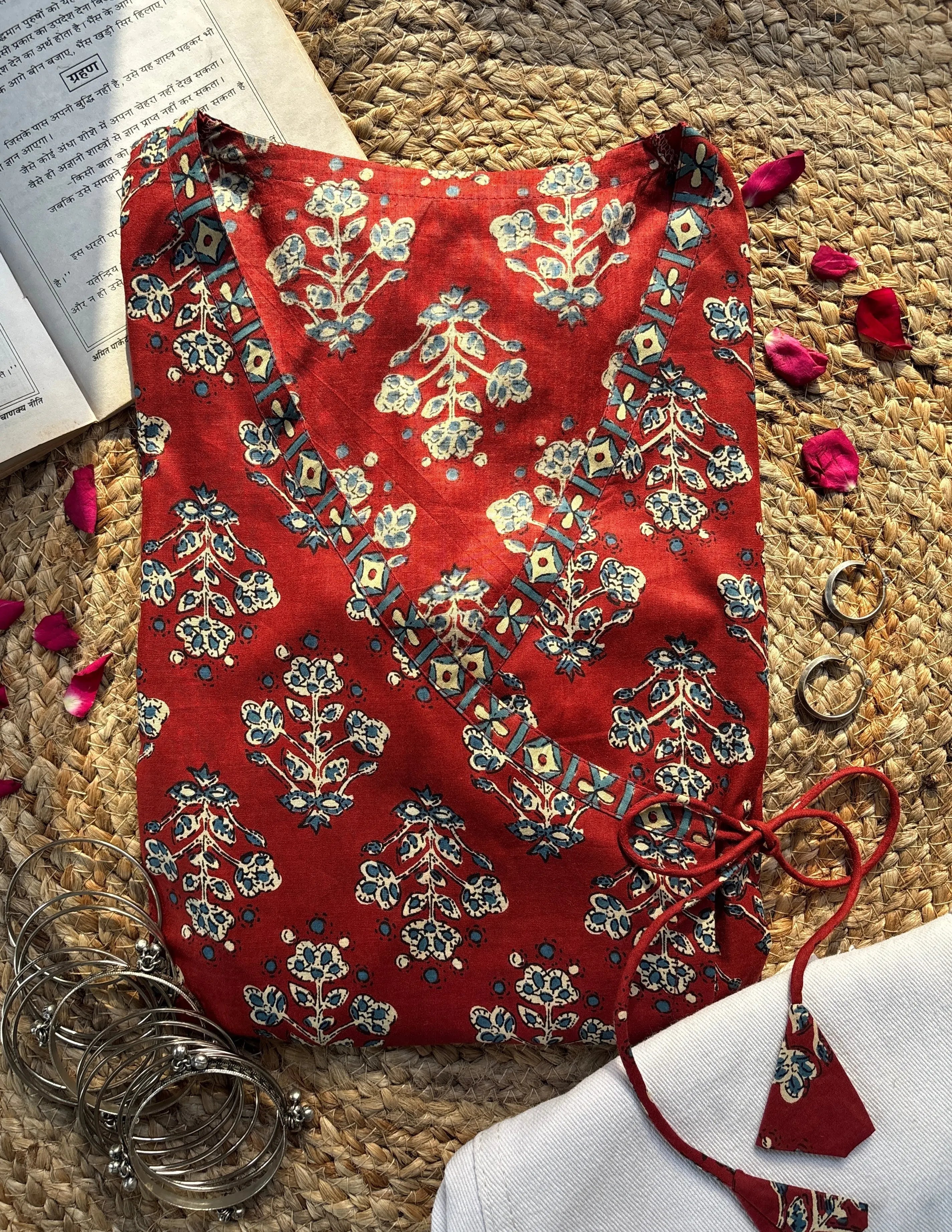 Ruhi short kurti with a traditional rust-red floral print and an adjustable wrap-around silhouette – Kalyanja.